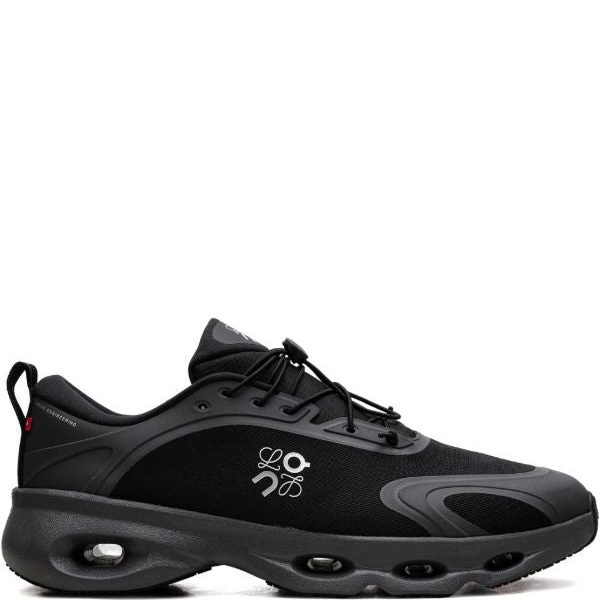 Black athletic sneaker with a chunky cushioned sole and visible air pockets, lace-up design and pull tab at the heel.