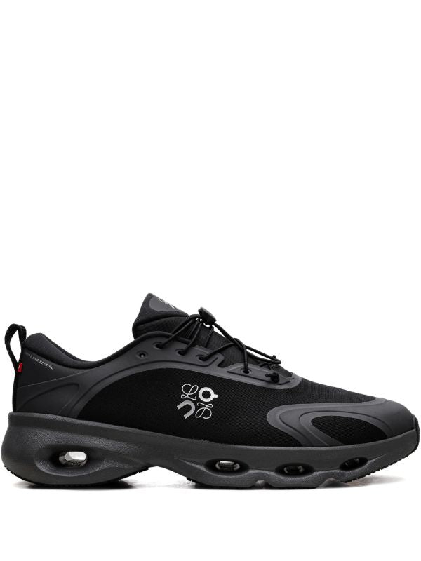 rn-image_picker_lib_temp_3582e860-a73c-4eaf-8ef1-8e8de6468c81 | UAE SPORT STORE Black athletic sneaker with a chunky cushioned sole and visible air pockets, lace-up design and pull tab at the heel.