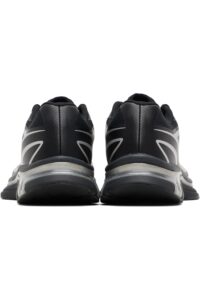 rn-image_picker_lib_temp_46e6f115-a953-4101-9d8a-0258a46762f4 | UAE SPORT STORE Back view of two black sneakers facing forward, placed side by side on a white background, showing gray sole details.