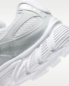 rn-image_picker_lib_temp_4eb3478d-2552-4b2f-b4bd-a85cd13c26d8 | UAE SPORT STORE Close-up of a white athletic sneaker focusing on the mesh upper and stitched overlays.