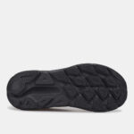Black rubber sneaker sole with multi-directional tread patterns for traction and grip.