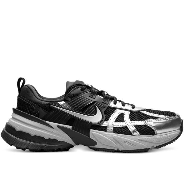 Black and gray Nike running shoe with a white swoosh, mesh upper, and chunky midsole.