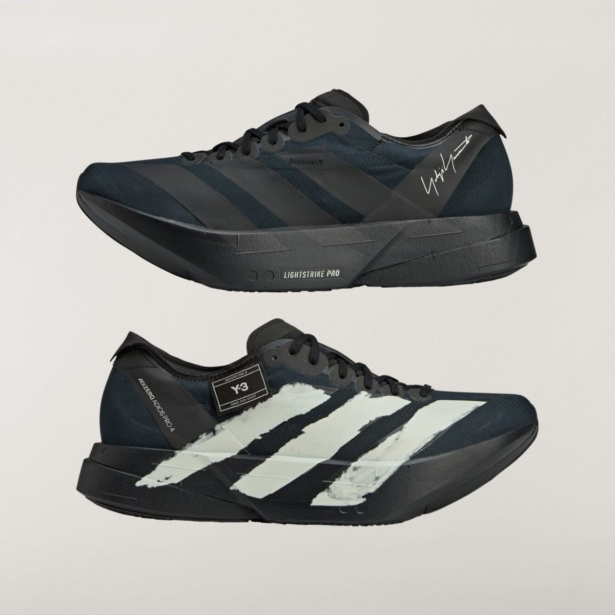 Close-up side view of a black athletic sneaker with a chunky platform sole and diagonal stripes.