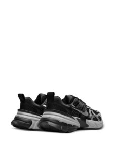rn-image_picker_lib_temp_66f619c0-b8c6-4588-b29f-5e61a1d3490f | UAE SPORT STORE Black athletic sneakers with a chunky gray sole, shown from a rear-side angle.