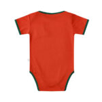 Back view of an orange baby onesie with dark green trim around the neck, sleeves, and leg openings.