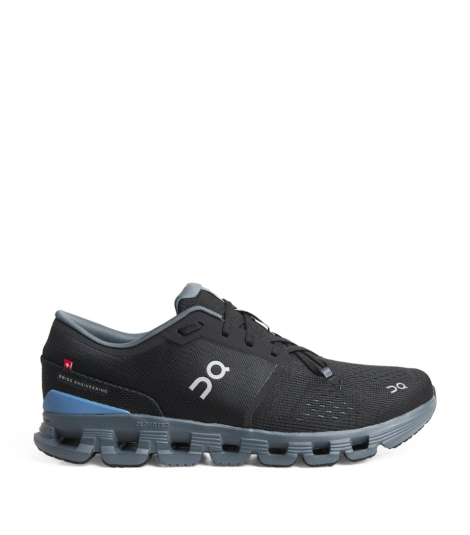 rn-image_picker_lib_temp_72ce7d8c-afb7-4af3-ba3c-bf06ceae188e | UAE SPORT STORE Black and gray athletic running shoe with blue heel counter and On logo on the side, shown in profile.
