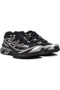 rn-image_picker_lib_temp_7360720c-1a8b-4715-a5ee-d5e066289c86 | UAE SPORT STORE Pair of black and silver running shoes with a geometric pattern and thick soles.