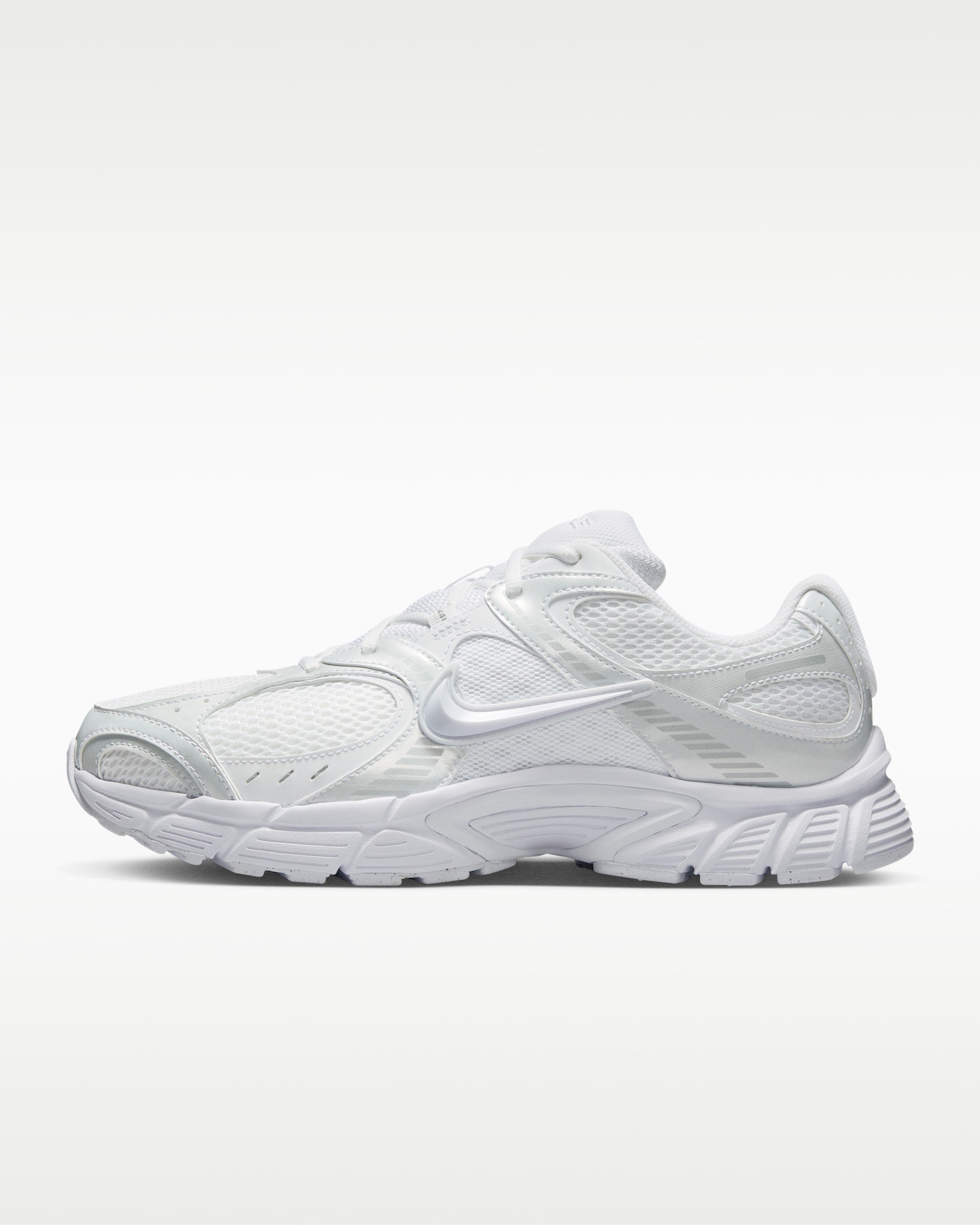 rn-image_picker_lib_temp_7660ab45-1431-4dee-a533-858ee45c2b06 | UAE SPORT STORE White athletic sneaker with mesh panels and chunky sole, viewed from the side on a white background