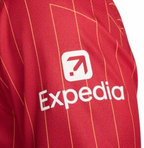 Close-up of a red sports jersey with orange pinstripes and the Expedia logo in a white square.