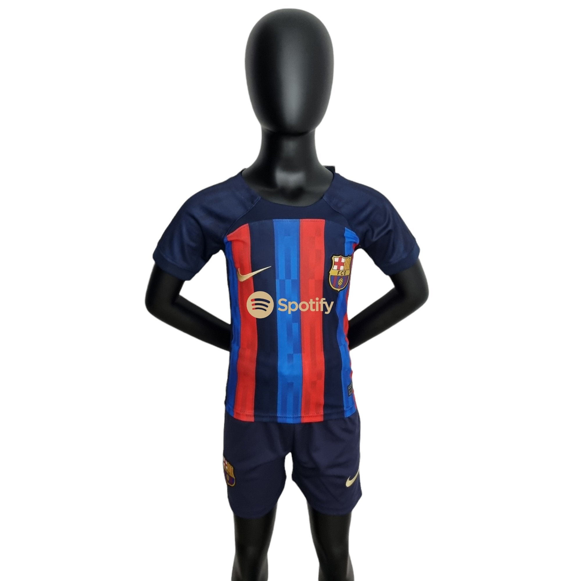 rn-image_picker_lib_temp_865245b3-8dbe-4dbe-b6a2-880a71c6ac2b | UAE SPORT STORE Black mannequin wearing FC Barcelona home jersey with blue and red vertical stripes against a white background.