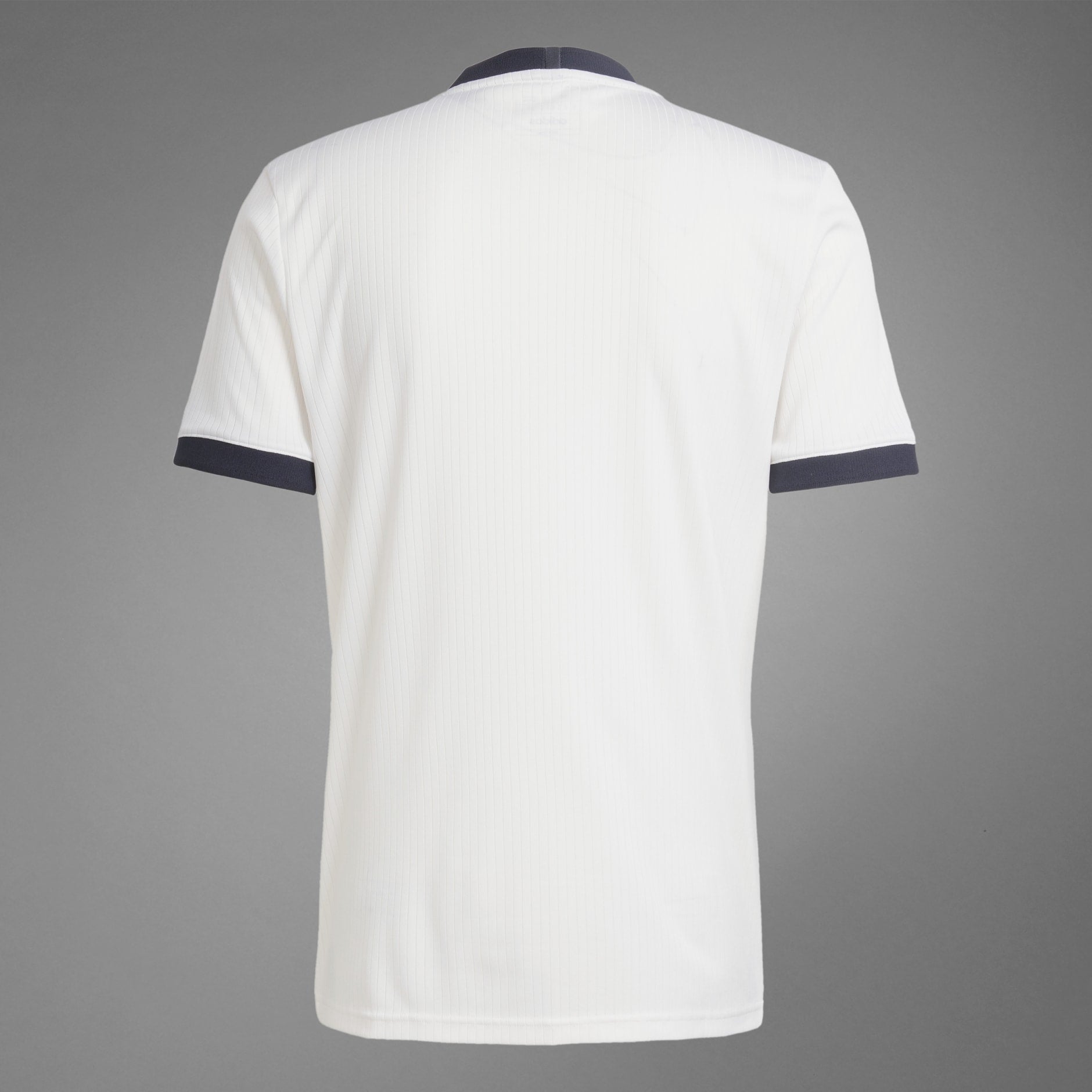 rn-image_picker_lib_temp_8c4da915-efc6-46b0-87ff-bd05d8a63027 | UAE SPORT STORE Back view of a white pinstriped polo shirt with navy sleeve trim against a gray background.