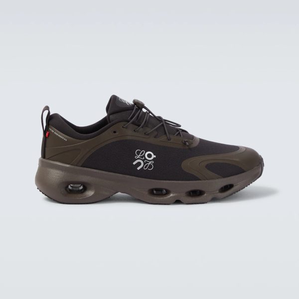 Black and brown athletic sneaker with a thick, segmented sole and a logo on the side
