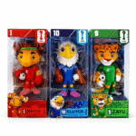 Three FIFA toy soccer figures in boxes: Maple (red goalkeeper), Clutch (blue midfielder), and Zayu (green striker).