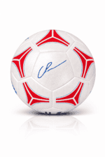 White soccer ball with red and blue geometric patterns and a blue autograph-style signature, placed on a white background with a subtle reflection.