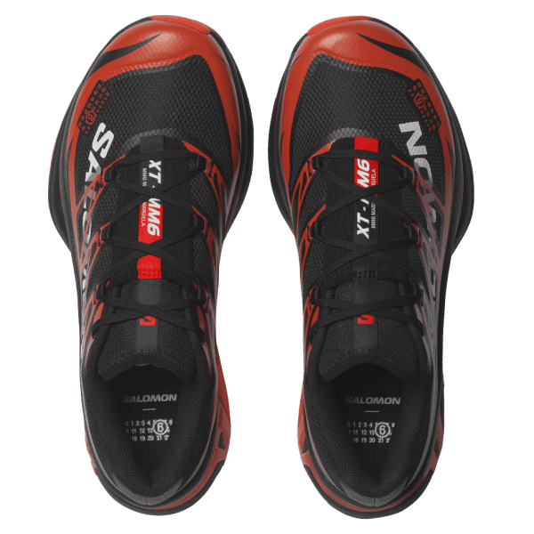 Pair of black and red Salomon running shoes viewed from top, laces tied, with XT WINGS branding on the tongues.