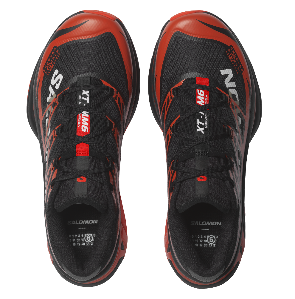 rn-image_picker_lib_temp_ce8f3565-ded8-4fbe-b324-cd07a191c4a8 | UAE SPORT STORE Pair of black and red Salomon running shoes viewed from top, laces tied, with XT WINGS branding on the tongues.