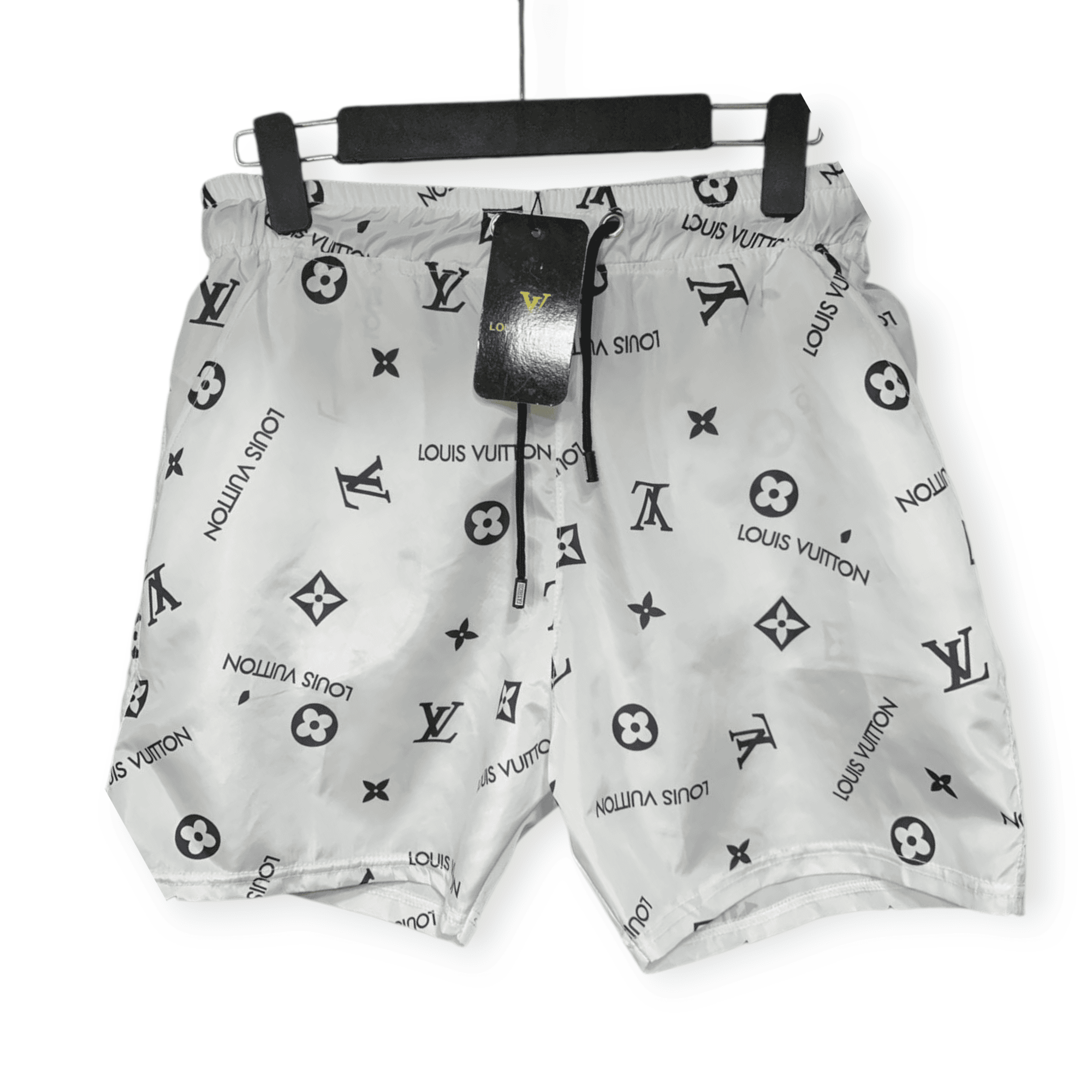 rn-image_picker_lib_temp_cfe0c843-2cfc-4ede-9abd-5f4b6e9e170a White Louis Vuitton bag with black repeating logo pattern, hanging from a padded horizontal hanger with a black tag attached.