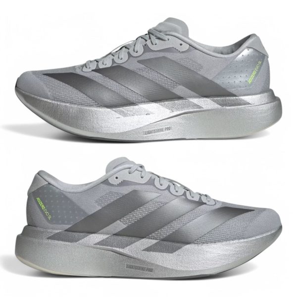 Two silver-gray running shoes shown from side and profile views with thick platform soles and three diagonal stripes on each side.