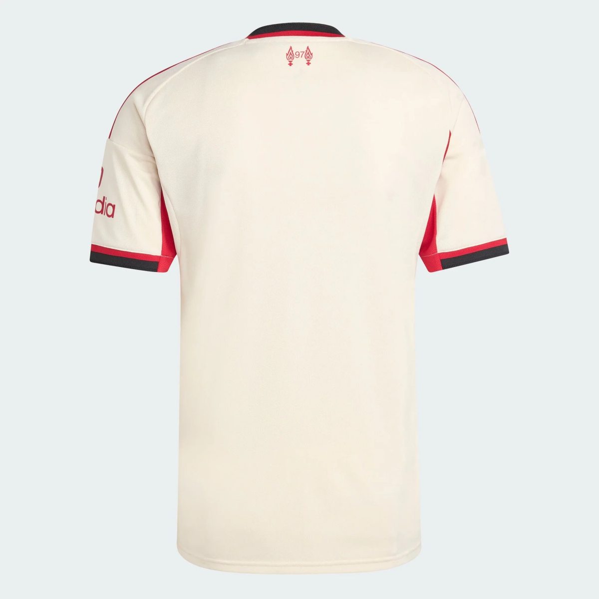 Back view of a cream-colored sports jersey with red piping along sleeves and a small crest near the collar chin.
