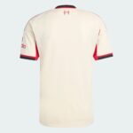 Back view of a cream-colored sports jersey with red piping along sleeves and a small crest near the collar chin.