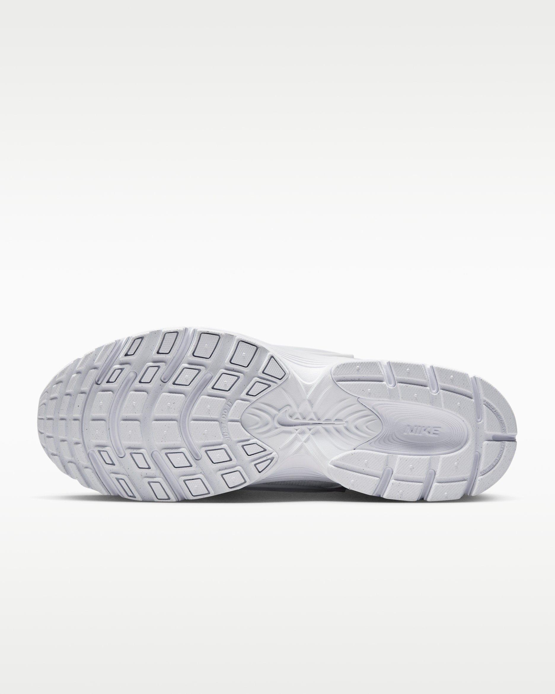 rn-image_picker_lib_temp_e306f9b1-57e2-4132-9e36-50095b33752f | UAE SPORT STORE Bottom view of a white Nike running shoe sole showing a multi-angled tread pattern on the outsole.