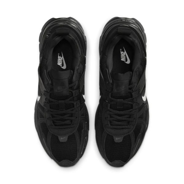 Pair of black Nike sneakers viewed from above, laces tied, white Nike swooshes visible on sides