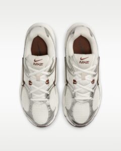 rn-image_picker_lib_temp_e7d12bdf-ea7d-4efe-a1fb-f061dd522e4a | UAE SPORT STORE Top-down view of two white Nike sneakers placed side by side on a white background.