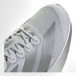 rn-image_picker_lib_temp_e96cb579-b5cb-474c-b53b-e37f6eb18e98 | UAE SPORT STORE Close-up of a silver Adizero running shoe showing laces and side stripes.