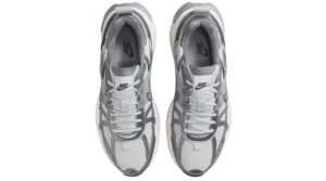 Top-down view of a pair of gray and white Nike running shoes side by side.