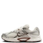 rn-image_picker_lib_temp_f4d74078-7b2e-4c83-8074-f318a2ecc231 | UAE SPORT STORE Side view of a white and silver Nike running shoe with mesh panels and a brown accent on the sole.