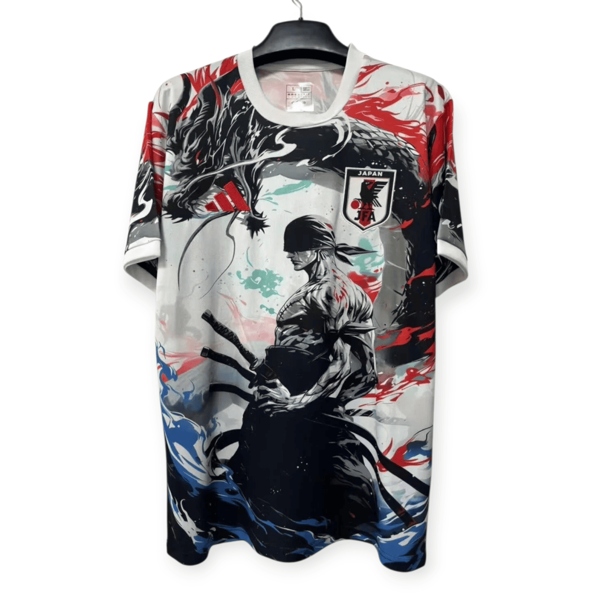 Colorful graphic sports jersey with a dragon design and the Japan JFA crest, hanging on a hanger.