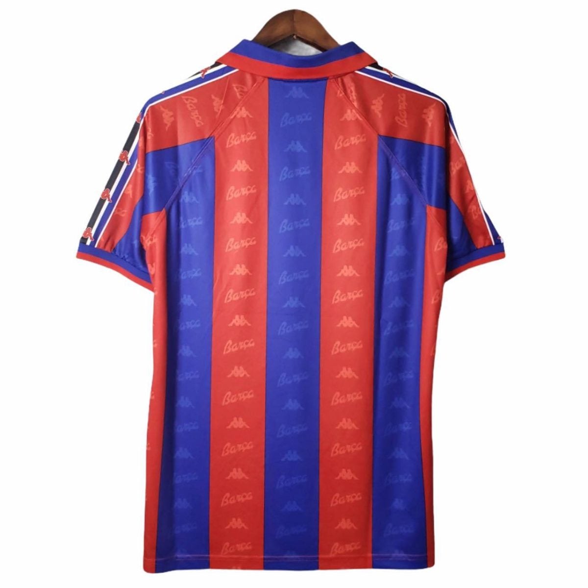 Back view of a red and blue vertical striped soccer jersey with repeating Kappa logos on the stripes.