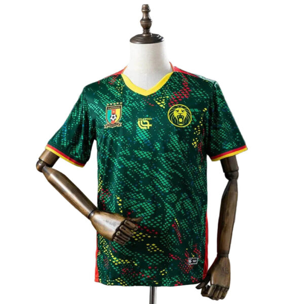 Cameroon national team football jersey on a mannequin, green with yellow trim and team logos on the chest.