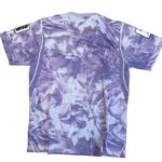 Back view of a purple lavender floral sports jersey with neon lime piping along the side seams and short sleeves.