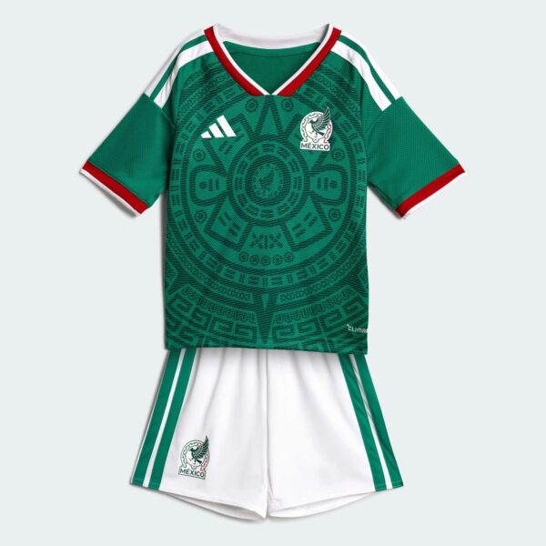 Mexico national team green jersey with white shorts, featuring crest and Adidas logo and decorative circular pattern