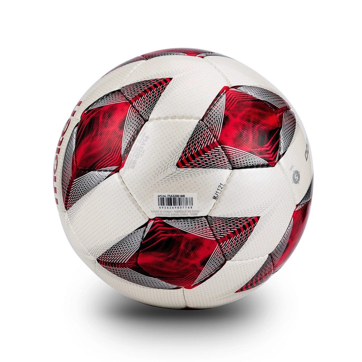 Close-up of a white soccer ball with red and black patterned panels and visible stitching against a white background.