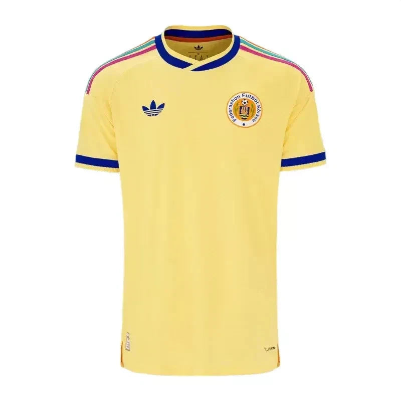s-l1600_1_e81448f7-75c9-4166-b516-e4081caa37ae Yellow football jersey with blue Adidas logo and crest on the chest, short sleeves with blue trim and multicolor shoulder stripes