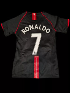 s-l1600_1_ef56fc55-97cc-4cde-b940-0e9bbd6aaff9 | UAE SPORT STORE Back of black Manchester United jersey with Ronaldo 7 and red trim on shoulder and vertical stripe