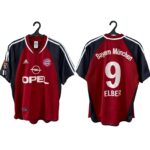 Two Bayern Munich football jerseys on hangers shown front and back; red with navy sleeves, white stripes, crest, and Opel sponsor on the front.