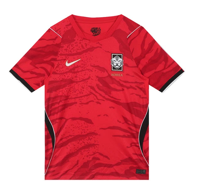 s-l1600_31e192c9-dbcb-4b29-8d72-8eed2373e7ad Red Korea national football team jersey with a white Nike swoosh and black-trimmed sleeves, featuring a tiger crest on the chest and side panels in black on white accents.
