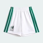 White athletic shorts with green side stripes and a Mexico crest/logo near the hem.