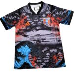 Japan national football team jersey featuring a bold wave pattern in black, gray, blue and orange with the JFA crest on the chest
