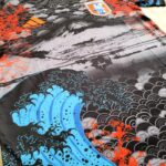 s-l1600_8_ea4a58d8-c5a5-4038-832c-f6dbbe4ac8ff | UAE SPORT STORE Decorative textile with bold blue waves, a black-gray seigaiha pattern, and bright orange floral accents.