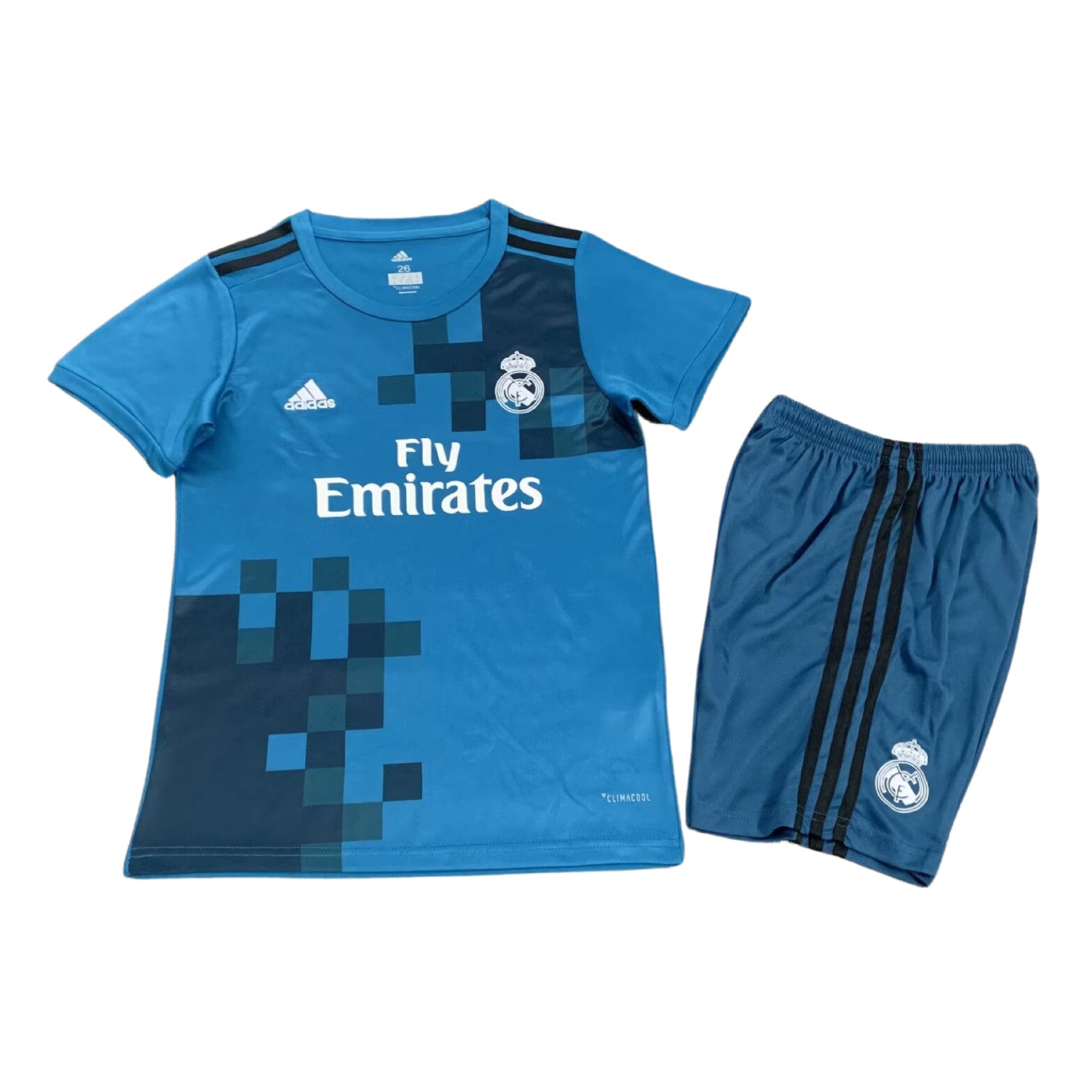 s-l1600_8be76f89-bc40-42f2-9337-c03ec0fc39b0 Blue Real Madrid football jersey with crest, sponsor Fly Emirates, and matching shorts with black stripes.