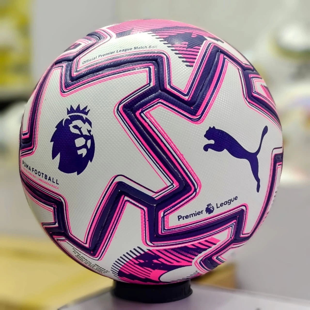s-l1600_a2ba8c24-2168-40f3-b273-6773857639cc | UAE SPORT STORE White Premier League football with pink and purple geometric patterns, showing the Premier League and Puma logos.
