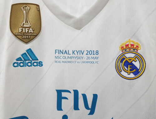 s-l500_13_c9fca60b-6871-4934-8313-15abd078e7e6 | UAE SPORT STORE White Real Madrid football jersey featuring the FIFA World Champions 2017 badge, Adidas logo, Real Madrid crest, and Fly Emirates sponsor.