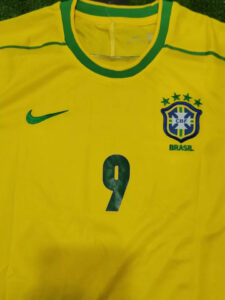 s-l960_12 | UAE SPORT STORE Yellow Brazil national football jersey with green trim, Nike swoosh, CBF crest with five stars, and number 9.