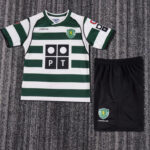 Sporting CP green-and-white striped soccer jersey with sponsor logo PT and black shorts showing Sporting crest on a gray carpeted surface