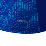 Close-up of blue athletic fabric with a pixel-like pattern and the DRYCELL logo.