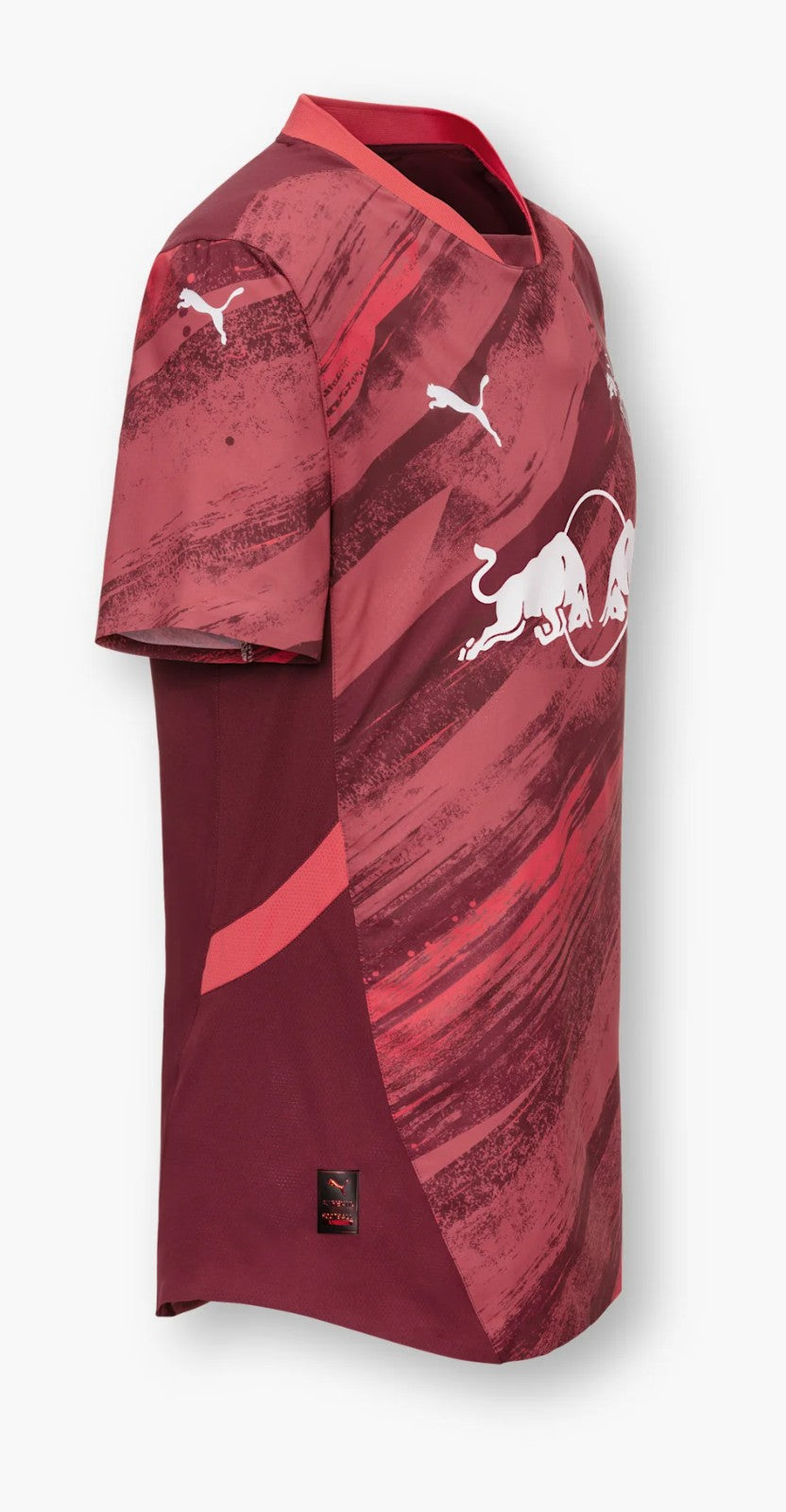 topW4kxJb76Ua3Q | UAE SPORT STORE Maroon short-sleeve athletic jersey with abstract red brush strokes, white Puma logos, and a white bull emblem on the front in the center.